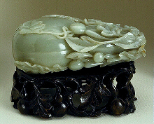 Celadon jade box, carved as a double gourd surrounded by foliage, and young gourds.  Chinese, 18th century.  